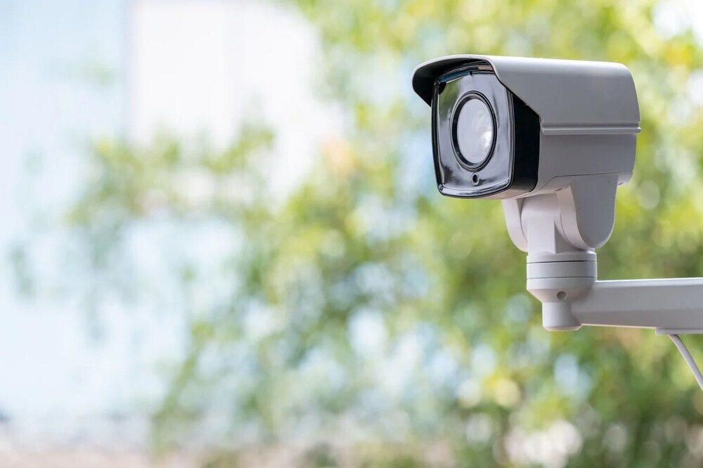 Outdoor security camera overlooking a property entrance Outdoor security camera overlooking a property entrance
